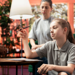 Teen girl distracted and withdrawn instead of doing homework. Assessment or assessments article focus image.