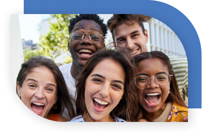 Young adults smiling and laughing as they look at the camera.